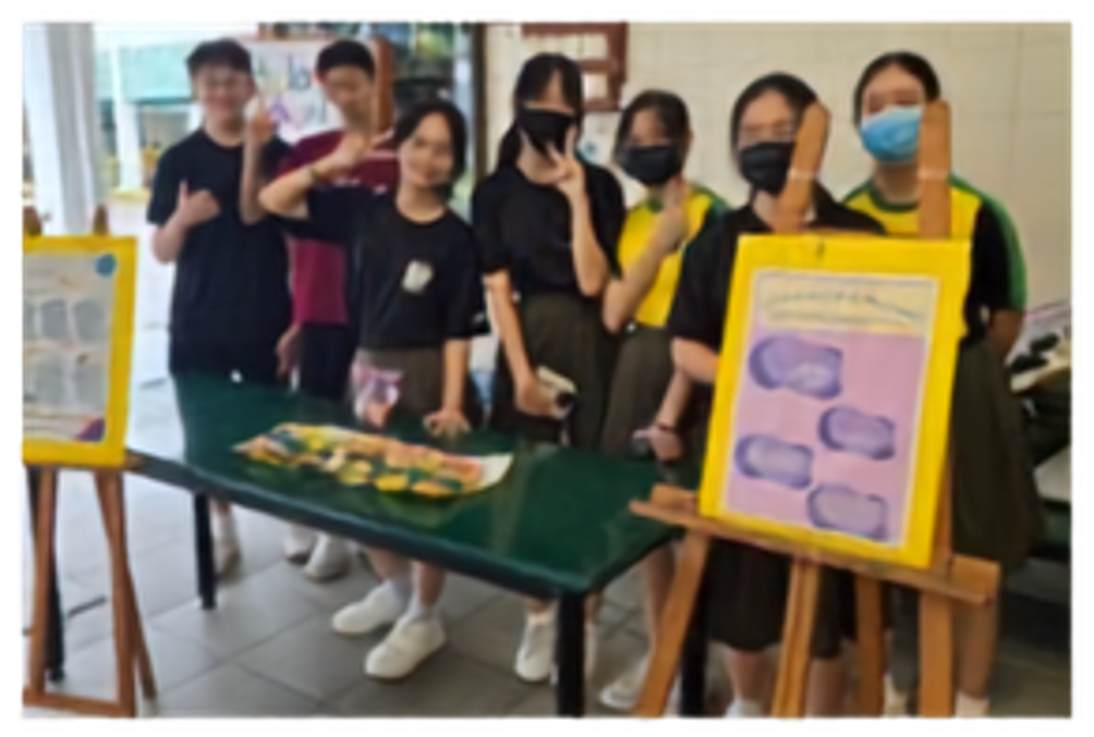 Secondary 4 students sharing tips with schoolmates on protection against Online Scams.